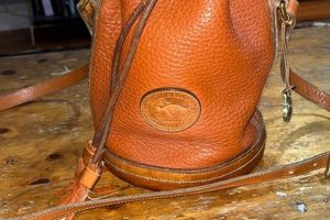 Timeless Style: Vintage Dooney Bucket Bag - Shop Now! | Vintage Treasures: Discover Rare Antiques, Collectibles & Retro Finds